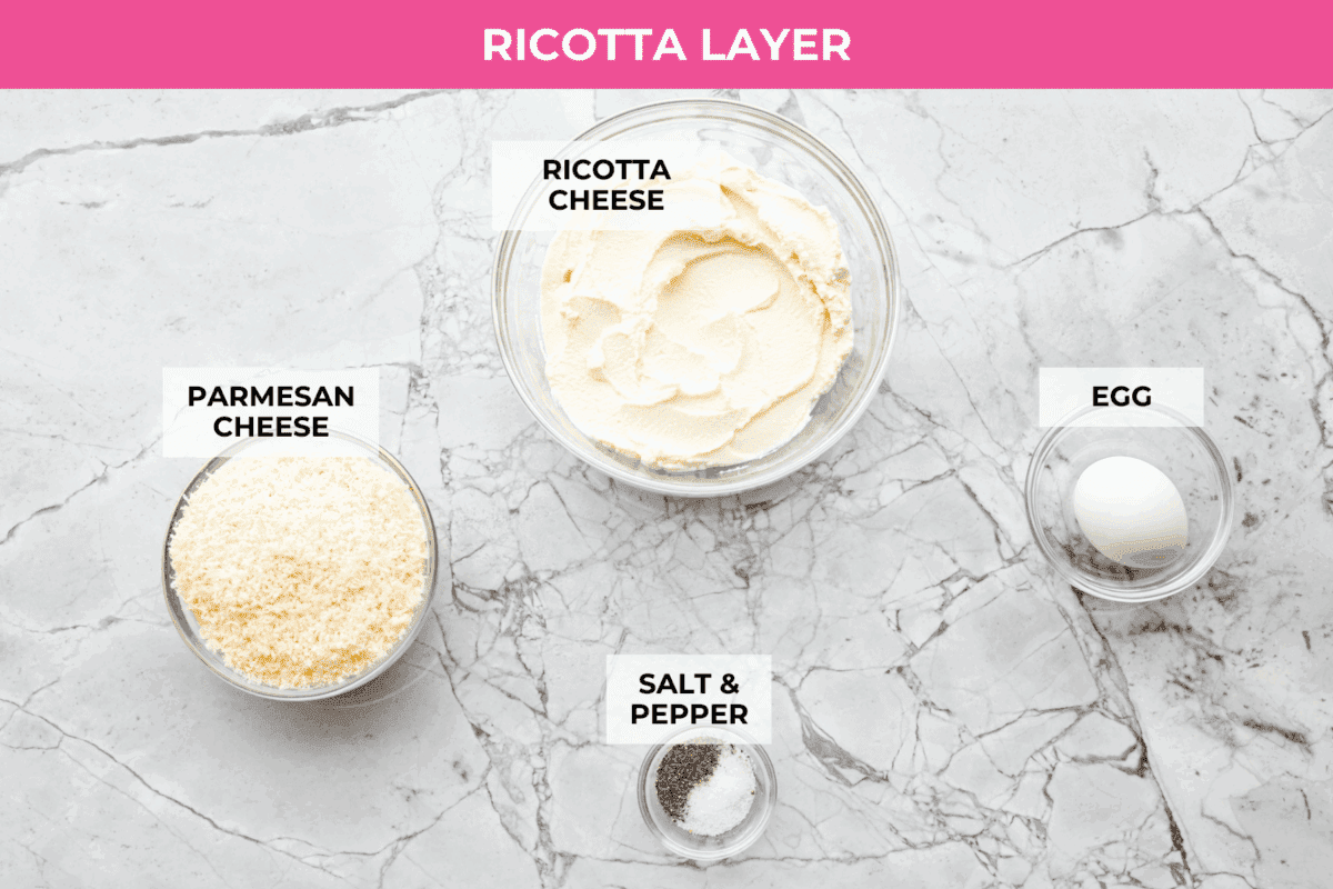 They don’t call it Marry Me Lasagna for nothing! One bite of the creamy sauce, tender chicken, and melty cheese, and everyone will be saying, "YES!" Overhead shot of labeled ricotta layer ingredients.