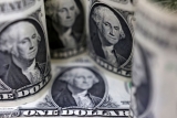 Dollar eases off three-week high as markets await Trump tariff clarity