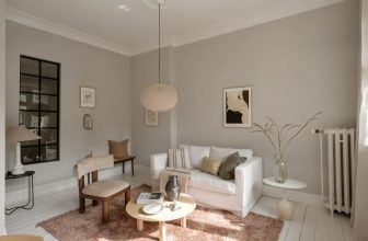 Deep green bedroom in a historic flat with white-painted floors