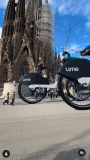 “The Streets Are Green Again”—a surreal CGI video showing oversized Lime bikes cruising past the iconic Sagrada Familia.