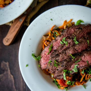 Whole 30 Grilled Flat Iron Steak Over Marinara Tossed Sweet Potato Noodles | Kita Roberts GirlCarnivore.com