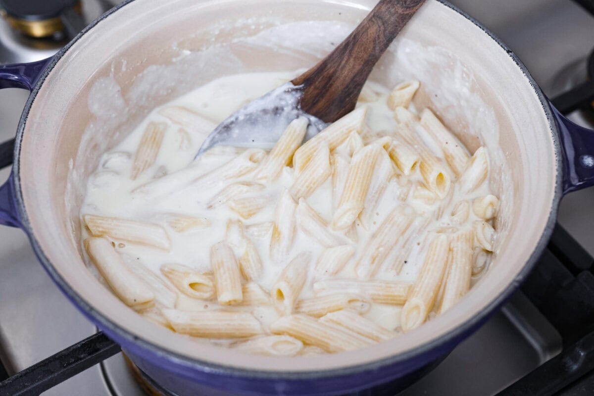 Craving something cozy, cheesy, and totally irresistible? My four cheese pasta brings comfort with a creamy ricotta base and a melty mix of easy-to-find Italian cheeses. It’s indulgent and totally hits the flavor jackpot! Cooked pasta added back to the pan with he cheesy, creamy sauce.