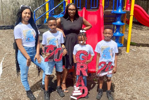 Kimberly Broadway with her four children on a playground