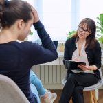 Teenage,Girl,High,School,Student,Talking,With,Mentor,,Psychologist,In