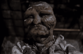 The Man in the Lower-Left Hand Corner of the Photograph