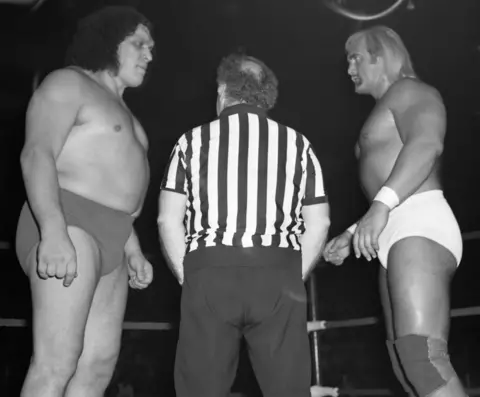 Getty Images Black-and-white photo of Hulk facing Andre the Giant in a ring with a referee between them in 1980