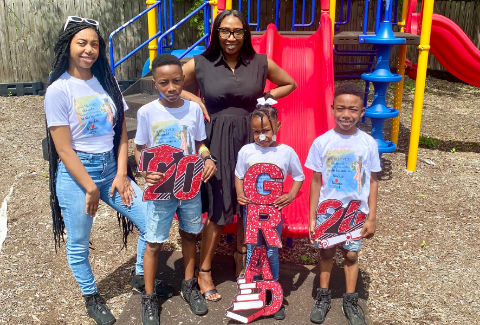 Kimberly Broadway with her four children on a playground