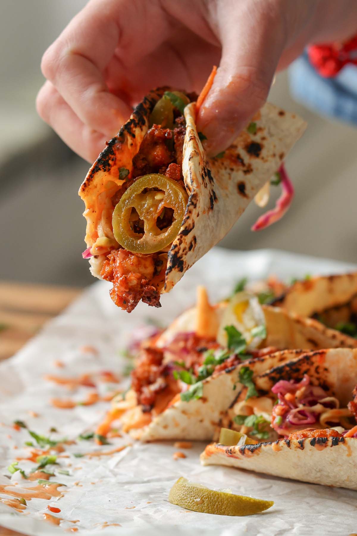 bite shot of a gochujang taco