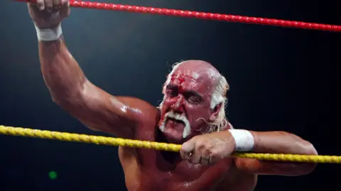 Getty Images Hulk Hogan with a bloodied face and eyes closed clinging on to the ropes during his 'Hulkamania Tour' at Acer Arena on November 28, 2009 in Sydney, Australia