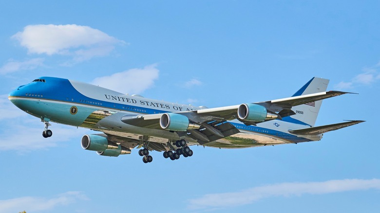 Air Force One landing with a blue sky in the background