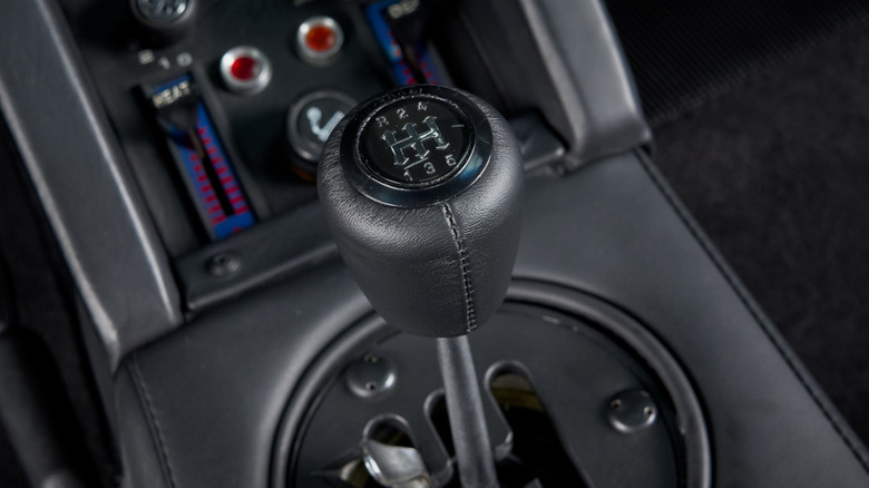 A closeup of the Lamborghini Countach dogleg shift lever and gate