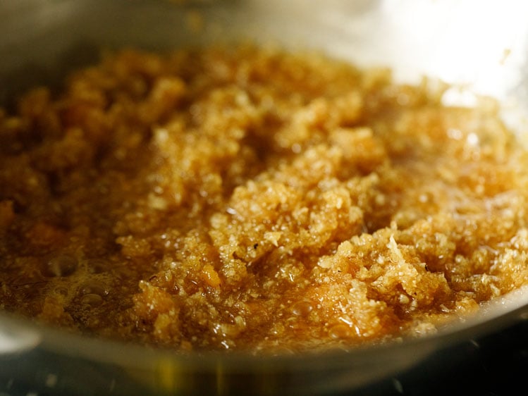 cooking coconut and jaggery on low heat. 