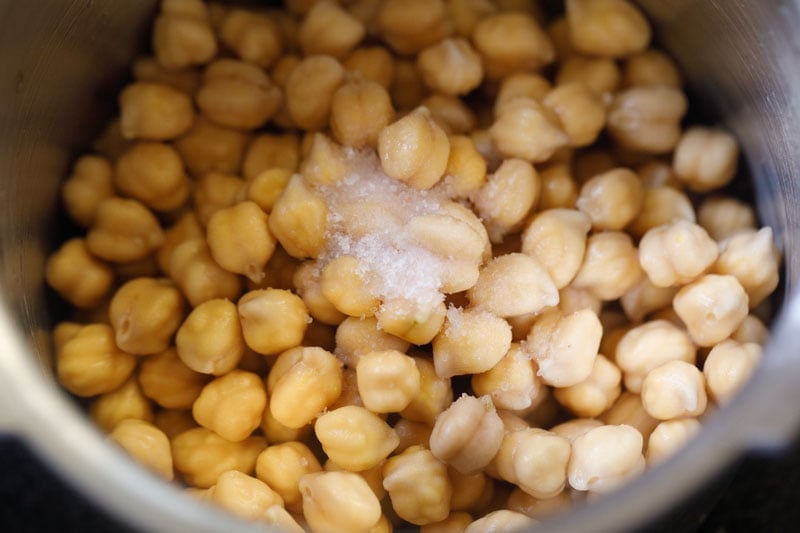 drained chickpeas and salt added to pressure cooker. 