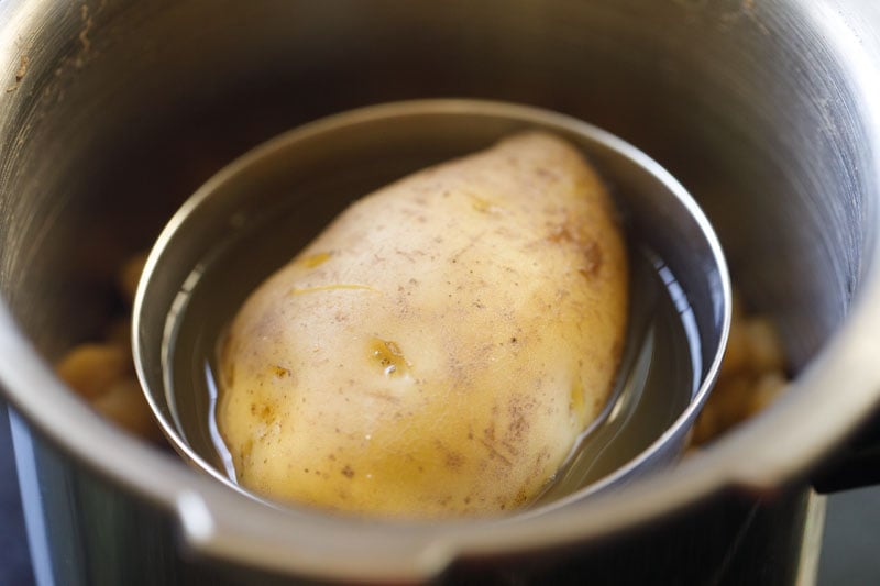 cooked potato and chickpeas in pressure cooker. 