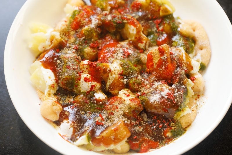 spice powders and seasoning sprinkled on chaat. 