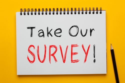 Take,Our,Survey!,Written,On,Notepad,With,Pencil,On,Yellow