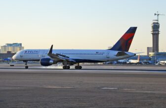 Delta passengers evacuate on slides after emergency landing