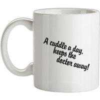 A cuddle a day keeps the doctor away mug.