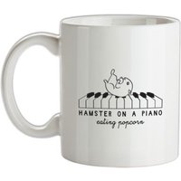 Hamster On A Piano Eating Popcorn mug.
