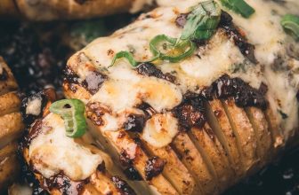 Hasselback Potatoes Stuffed with Bourbon Bacon Jam and Bubbling Blue Cheese 🥔🔥