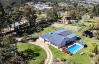 Dive in: Lindisfarne pool and tennis court home is No.1 listing