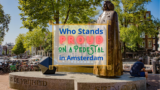 Who Stands Proud on a Pedestal in Amsterdam