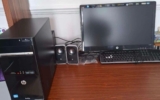 HP monitor with CPU, keyboard, mouse and Logitech speakers.