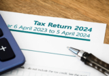 Do contractors using an umbrella company need to submit a tax return?