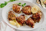 Grilled Lemon Chicken Thighs with Lemon Herb Sauce
