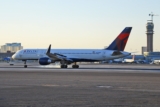 Delta passengers evacuate on slides after emergency landing