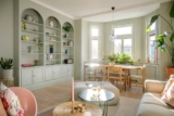 Pastel colors in a Swedish home with an eye-catching bookshelf