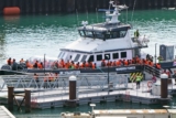Hundreds of migrants cross Channel after hiatus
